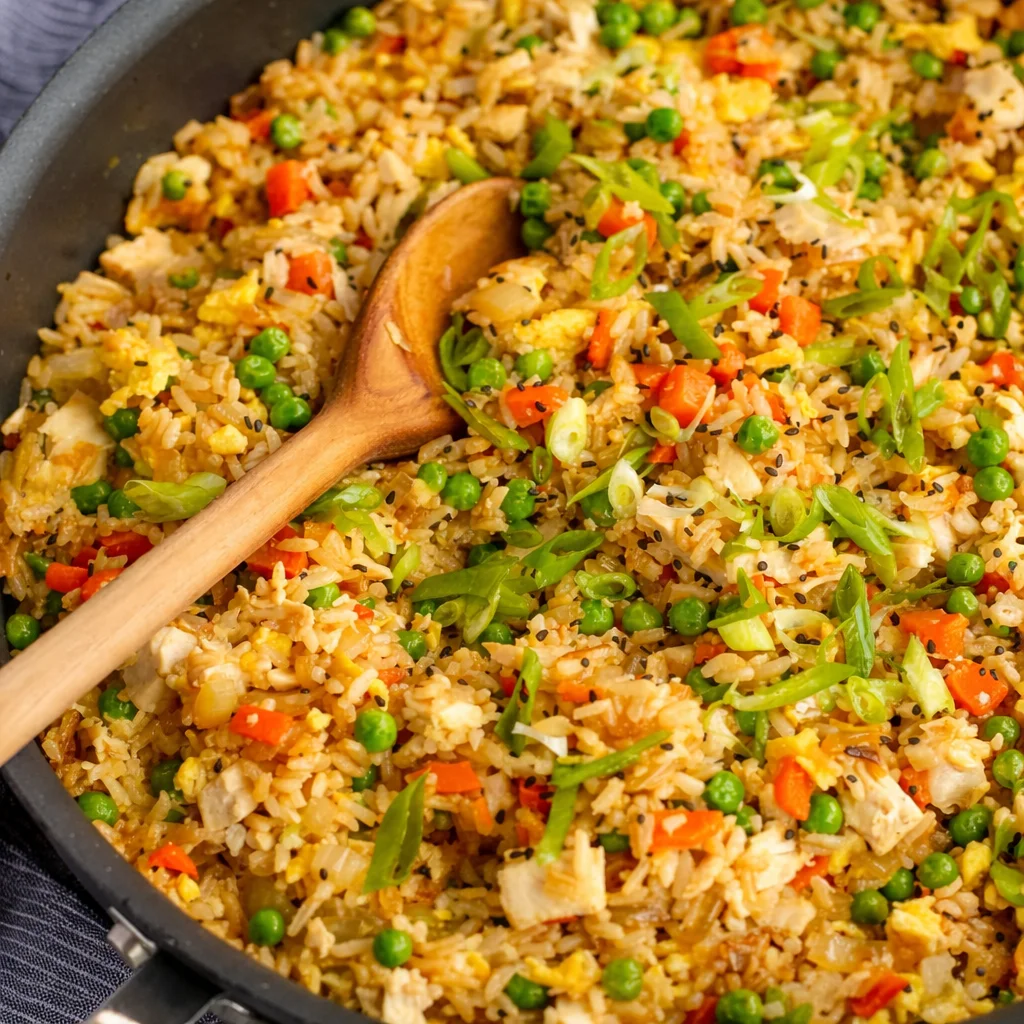 Delicious rotisserie chicken fried rice ready in 30 minutes with fresh vegetables.