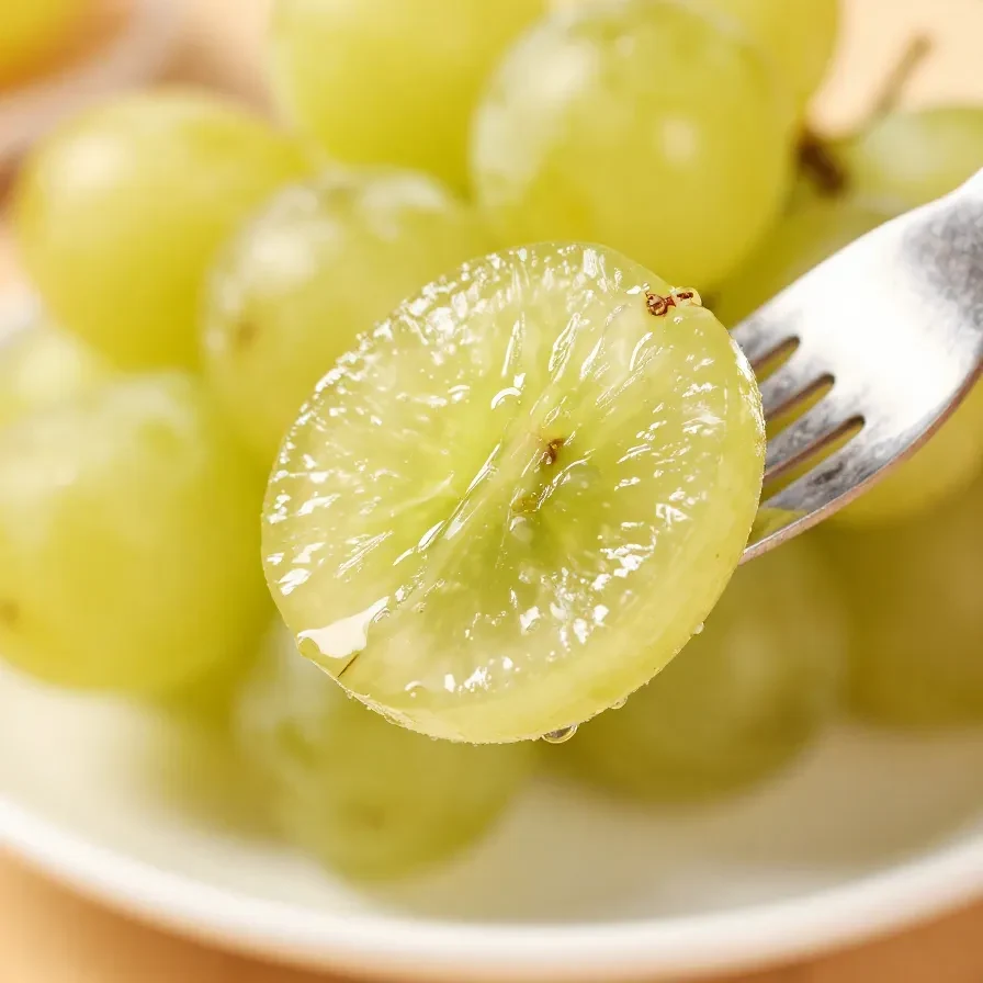 A close-up of vibrant purple grapes coated with Kool-Aid powder for a sweet and tangy treat.
